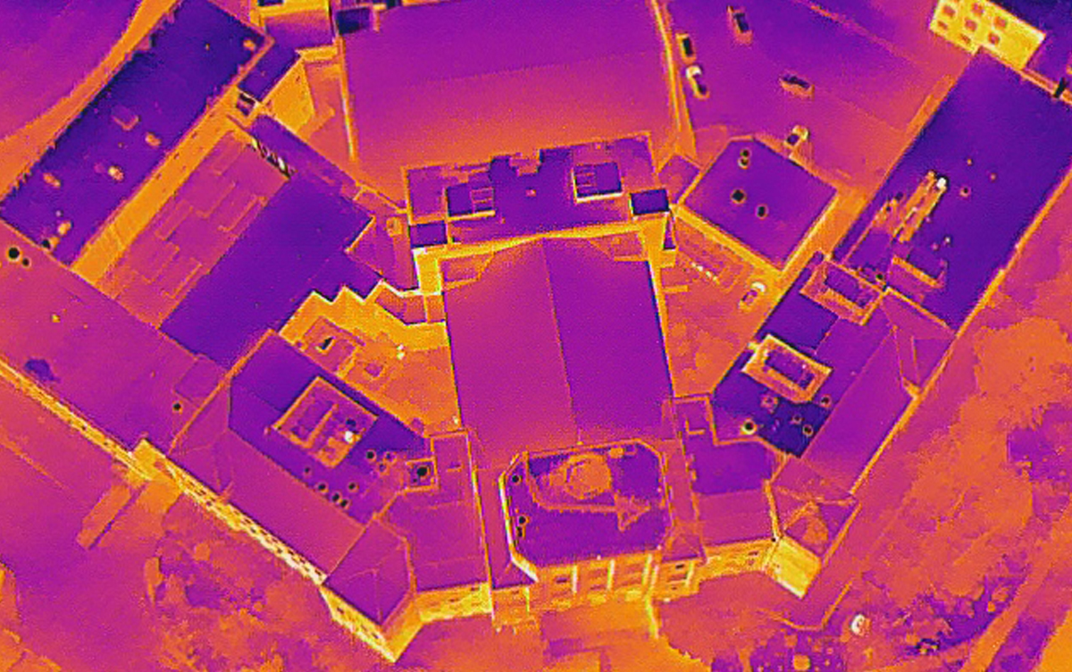 Thermal imaging analysis by RMT Roofing and Waterproofing Consultants identifying heat loss and moisture intrusion on a high school roof system.